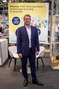 Jörg Bruss | Director, Global Business in front of the booth at the ceramitec 2022.